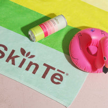 Load image into Gallery viewer, SkinTē Sparkling Tea on Lemon Lime Beach Towel